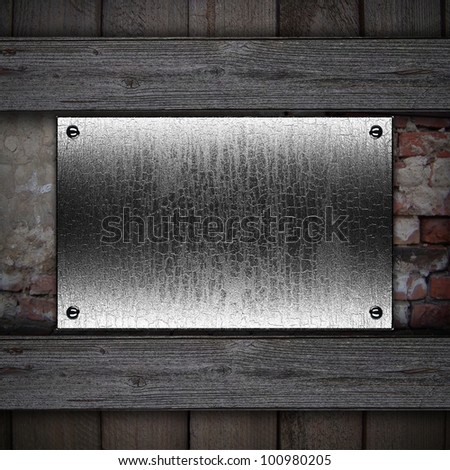 Metal plaque on a wooden background