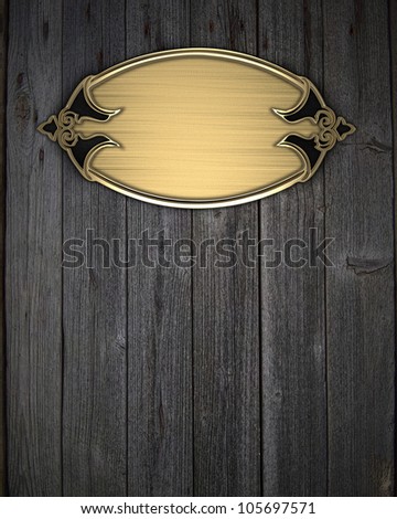 Beautiful frame on a gold nameplate on a wood background