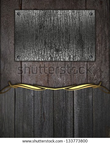 Wooden background, with name board with gold trim and rust plate