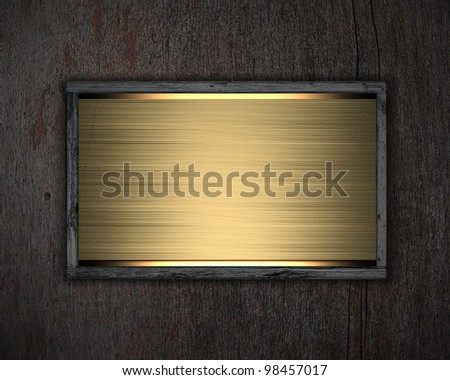 an gold poster on wooden background