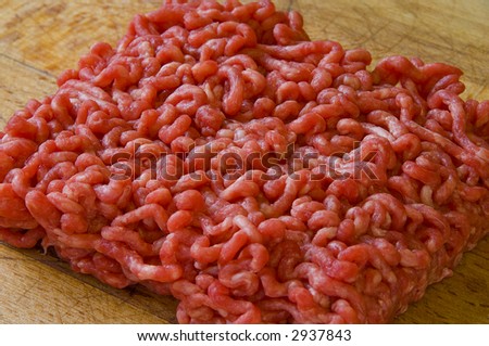 Close-up of raw beef mince on chopping board. Ground beef