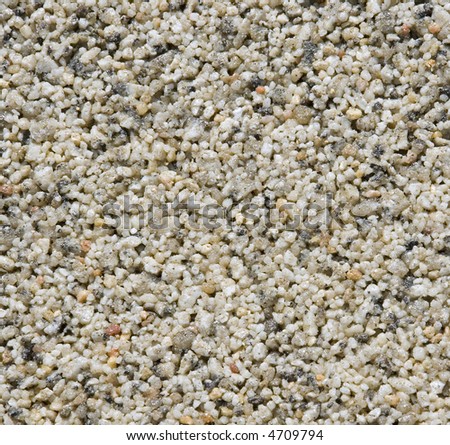 Detail of a path of natural rolled quartz sand grains, useful background or texture