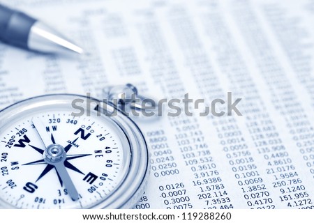 Compass and papers about financial issues