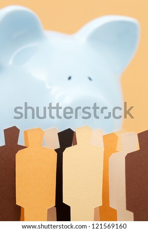 View of a crowd in front of a piggy bank. Concept of people against banks. Concept of people looking after their savings.