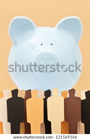 View of a crowd in front of a piggy bank. Concept of people against banks. Concept of people looking after their savings.