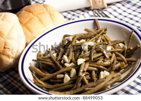 typical vegetarian dish of beans cooked with traditional Puglia (Italia) extra virgin olive oil and garlic
