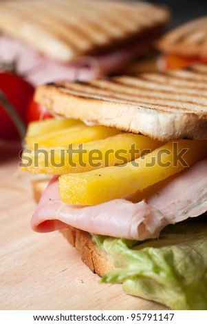Grilled toast with ham cheese tomato and lettuce