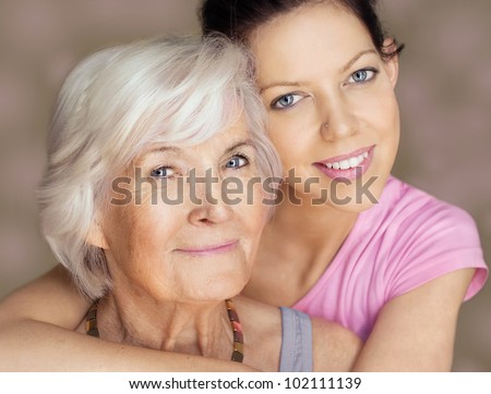 Grandmother and granddaughter portrait, embraced