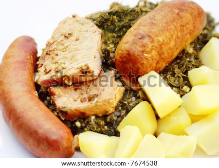 Northern Germany traditional winter meal, curly kale with smoked meat and sausages