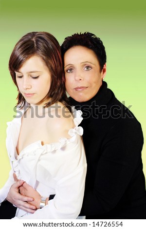 Mother and daughter embraced in black and white clothes