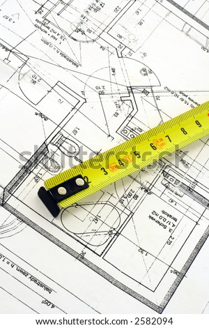Top view of a tape measure on top of floor plan