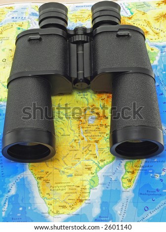 Black binoculars on a Africa map