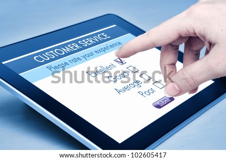 Online customer service satisfaction survey on a digital tablet Online customer service satisfaction survey on a digital tablet
