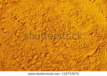 turmeric powder background, yellow grain abstract texture