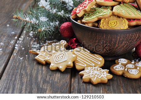 Christmas Ginger and Honey cookies on wooden background. Star, fir tree, heart, bear shape.
