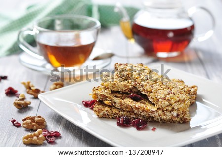 Muesli Bars on plate with nuts and dried fruits