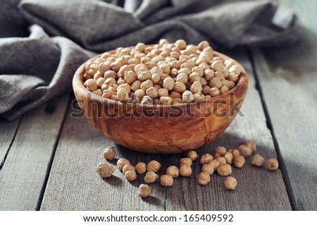 chick-pea in wooden bowl  on wooden background