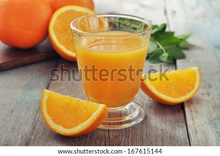Orange Juice In Glass With Mint, Fresh Fruits On Wooden Background