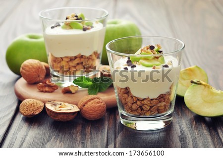 Homemade Dessert With Apple, Nuts, Yogurt And Granola In Glasses