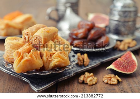Baklava, figs, nuts and dry dates on tray. Small shallow DOF