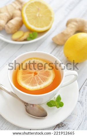 Ginger tea with lemon and mint tea  wooden background