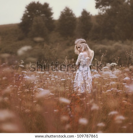 beautiful girl in a summer field