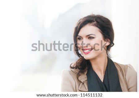portrait of a beautiful smiling woman outdoors