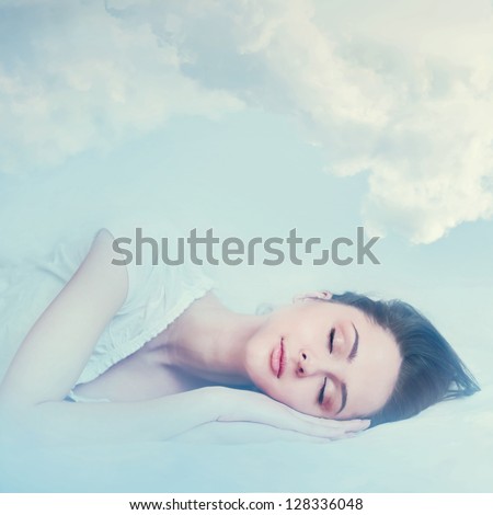 Beautiful Young Girl Sleeping And Dreaming In The Clouds
