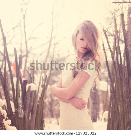 beautiful young woman in a freezing cold winter day