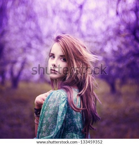beautiful girl in a vintage style in a fabulous purple park - stock photo