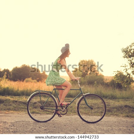 beautiful girl on a vintage bike