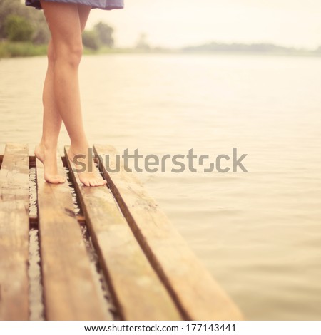 beautiful legs girl on the pier