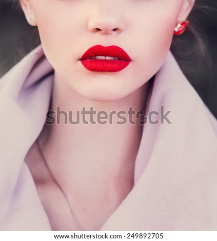 Girl with red lips. Photo in violet tones