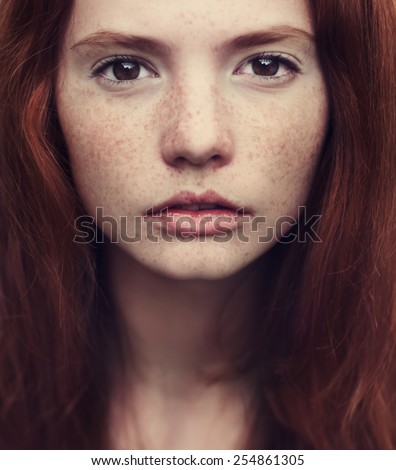 beautiful red-haired girl close-up