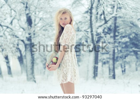 beautiful blonde in the woods in winter