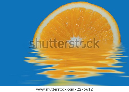 orange floating in water on background sky