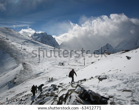 Caucasian mountains, Elbrus, wild mountain landscape, snow-clad  high peaks, snow and blue sky