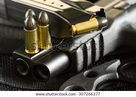 9mm ammunition and military special ops handgun with spare magazine and tactical knife
