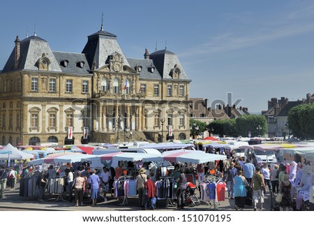 Autun,France-June 07,2013: View at the open air market in Autun,France. This market is held on mornings in front of the city hall at the  place du champ de mars  . June 7,2013 Autun, France