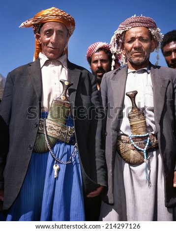 HABBAH,YEMEN- APRIL 23, 2011; Two old men in djellaba and with the traditional jambiya. Every man in Yemen wears a knife called jambiya.April 23,2011 Habbah,Yemen