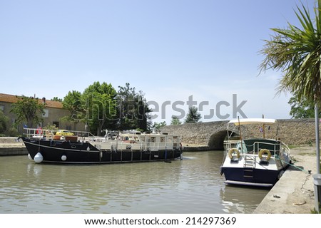 Boats at the Canal de Midi at the village of Capestang in Southern France