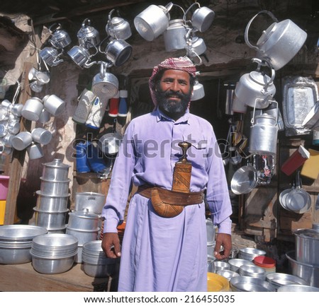 SANA\'A, YEMEN - APRIL 14, 2010: Merchant in front of his shop full of different household articles. April 14,2010 Sana\'a, Yemen