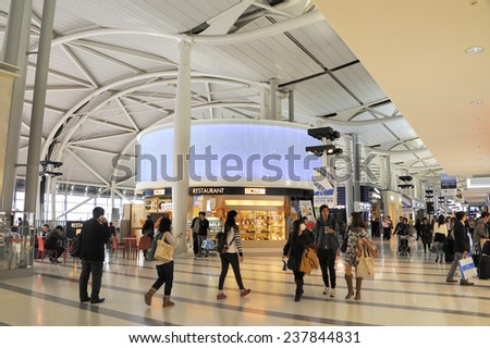 OSAKA,JAPAN - NOVEMBER 12, 2014; Travelers and shops at Kansai International Airport. This is the Osaka International Airport. November 12, 2014 Osaka, Japan