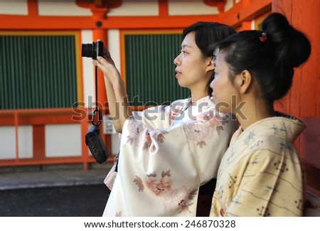 KYOTO, JAPAN - NOVEMBER 3, 2014: Two geisha\'s making a photo at the Enryaku-ji Temple. This is an Unesco World Heritage site.November 3, 2014 Kyoto, Japan
