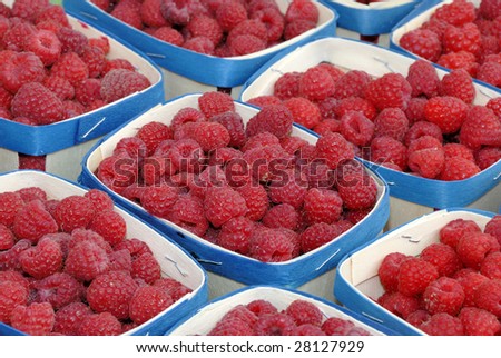 raspberries in containers on a French farmers market