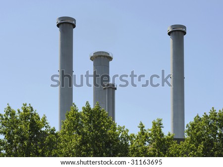 Factory pipes at a power plant producing clean air