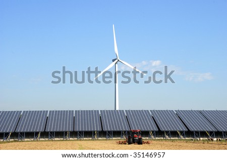 Solar plant with wind turbine at a farm in the Netherlands.