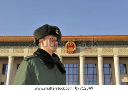 BEIJING - DEC 14: A sentry stands guard in front of The Great Hall of the People in Beijing, China on Dec 14, 2010.