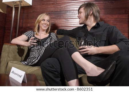 Man and Woman in a conversation at a wine lounge