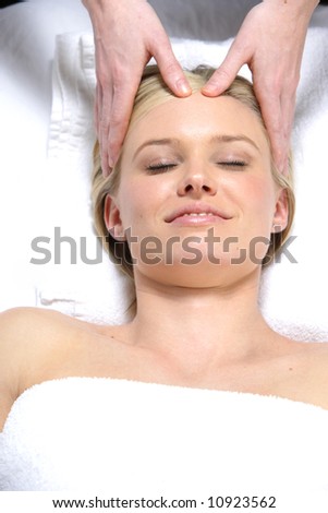 A woman gets a massage at a day spa